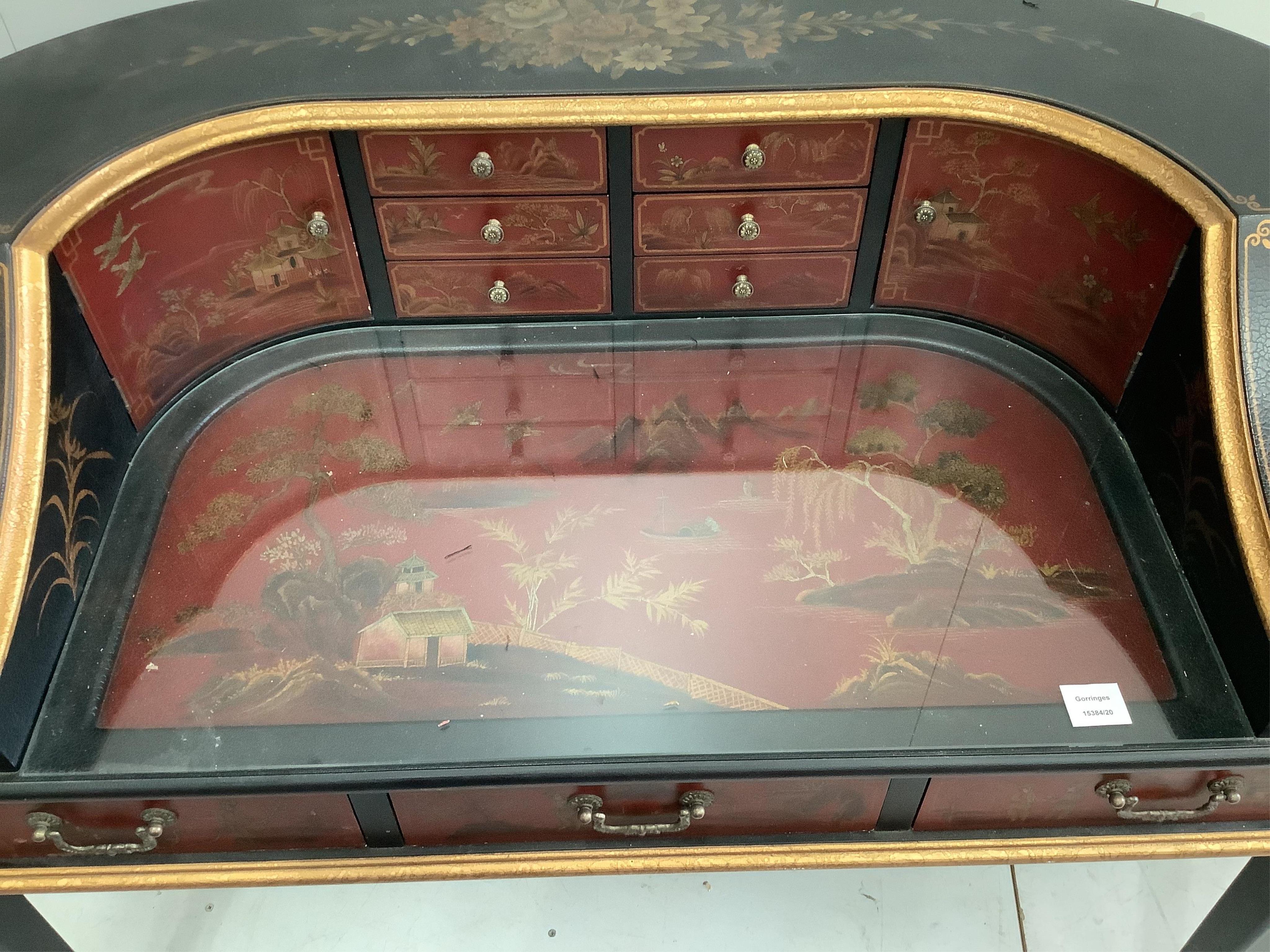 A reproduction chinoiserie painted Carlton House type desk, width 126cm, depth 64cm, height 89cm. Condition - fair